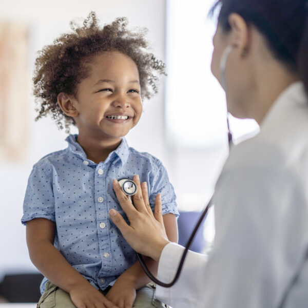 Doctor Listening to Little Boys Heart