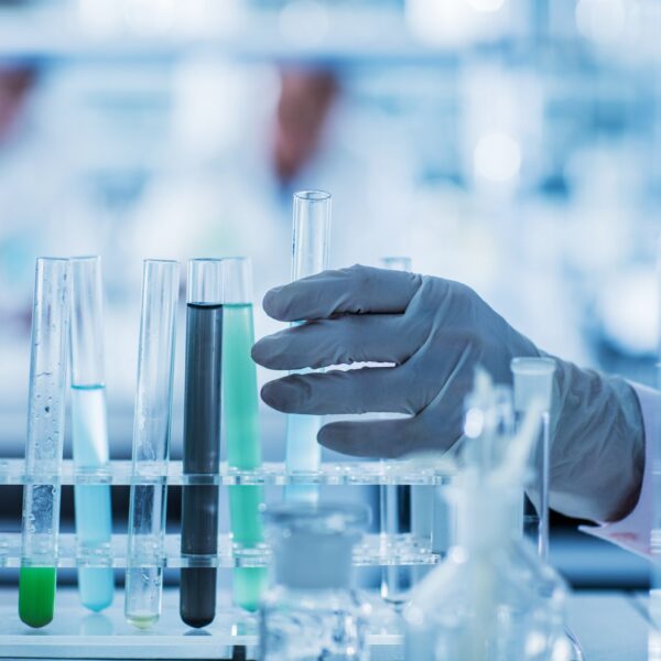 gloved hand in lab